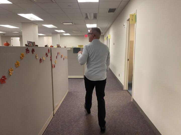 Jim walking in office
